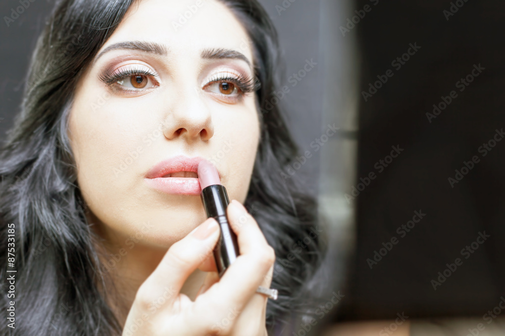 makeup artist woman doing make-up using cosmetic brush for yourself makeup artist woman doing make-up using cosmetic brush for yourself