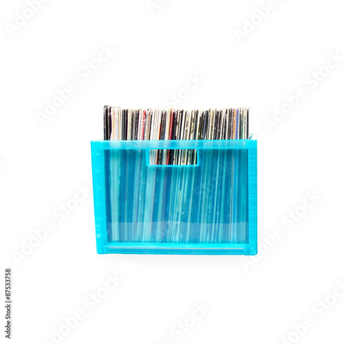 Vinyl disks in plastic boxes isolated on white photo