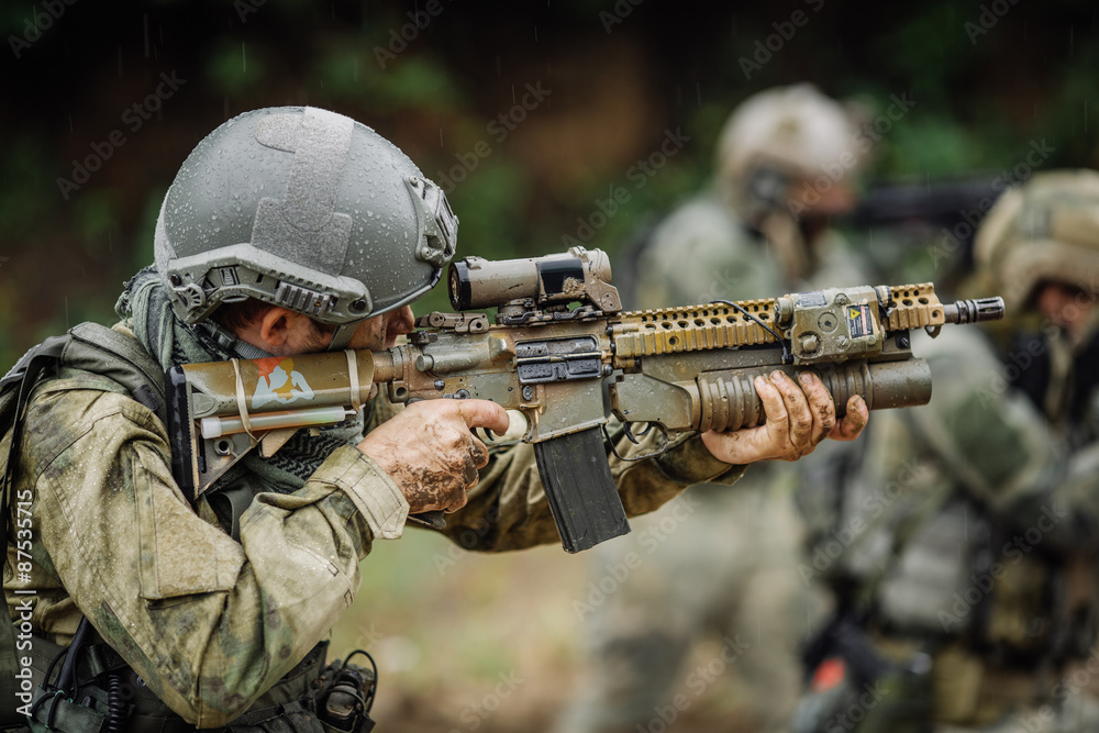 Portrait of a ranger in the battlefield with a gun Portrait of a ranger in the battlefield with a gun