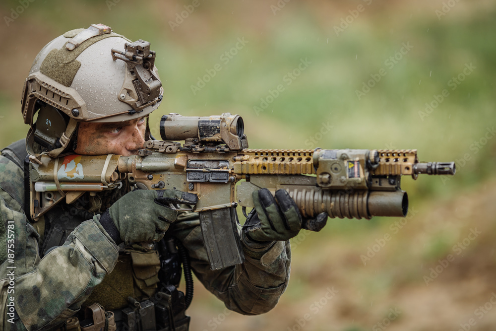 Portrait of a ranger in the battlefield with a gun Portrait of a ranger in the battlefield with a gun