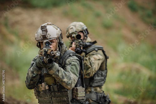 Portrait of a ranger in the battlefield with a gun