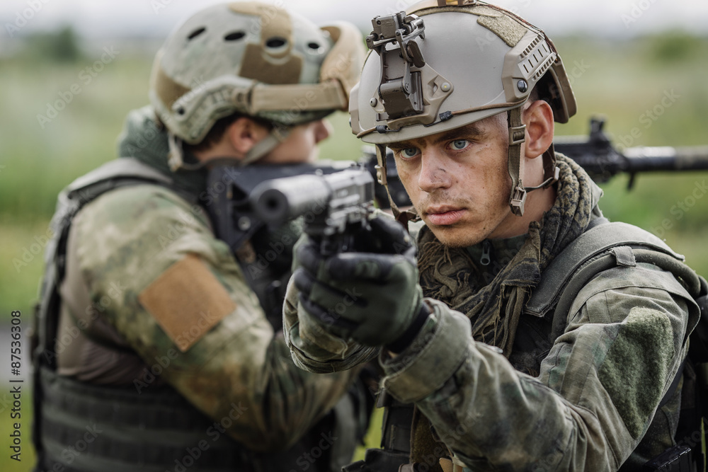 Portrait of a ranger in the battlefield with a gun Portrait of a ranger in the battlefield with a gun