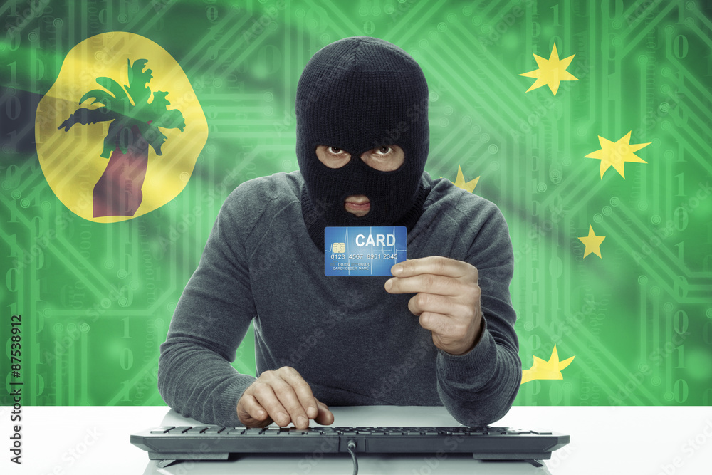 Dark-skinned hacker with flag on background holding credit card - Cocos (Keeling) Islands Dark-skinned hacker with flag on background holding credit card - Cocos (Keeling) Islands