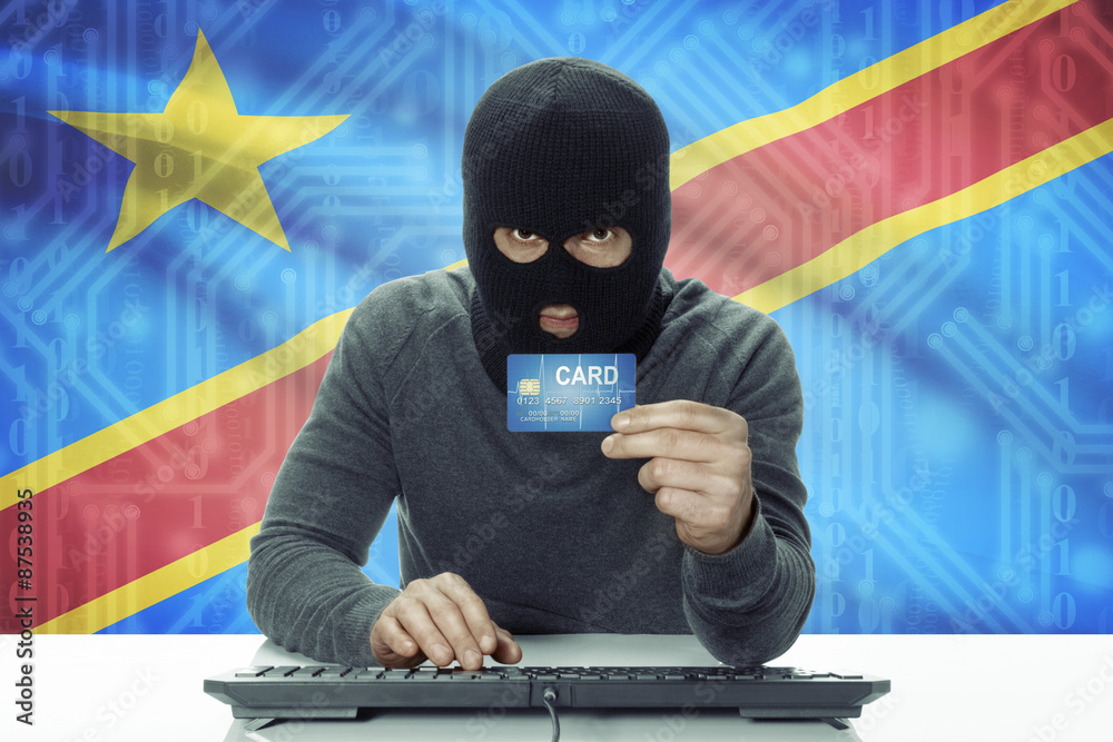 Dark-skinned hacker with flag on background holding credit card - Congo-Kinshasa Dark-skinned hacker with flag on background holding credit card - Congo-Kinshasa