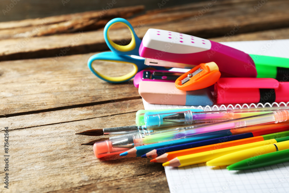 Fototapeta premium Bright school stationery on old wooden table