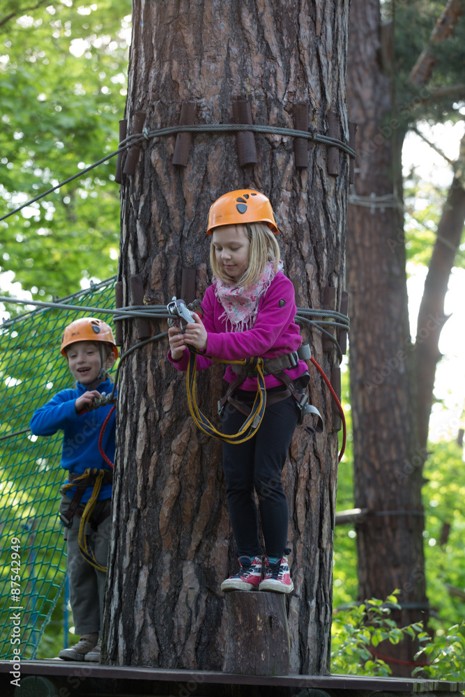  rope park, Girl and boy  climbing in adventure park