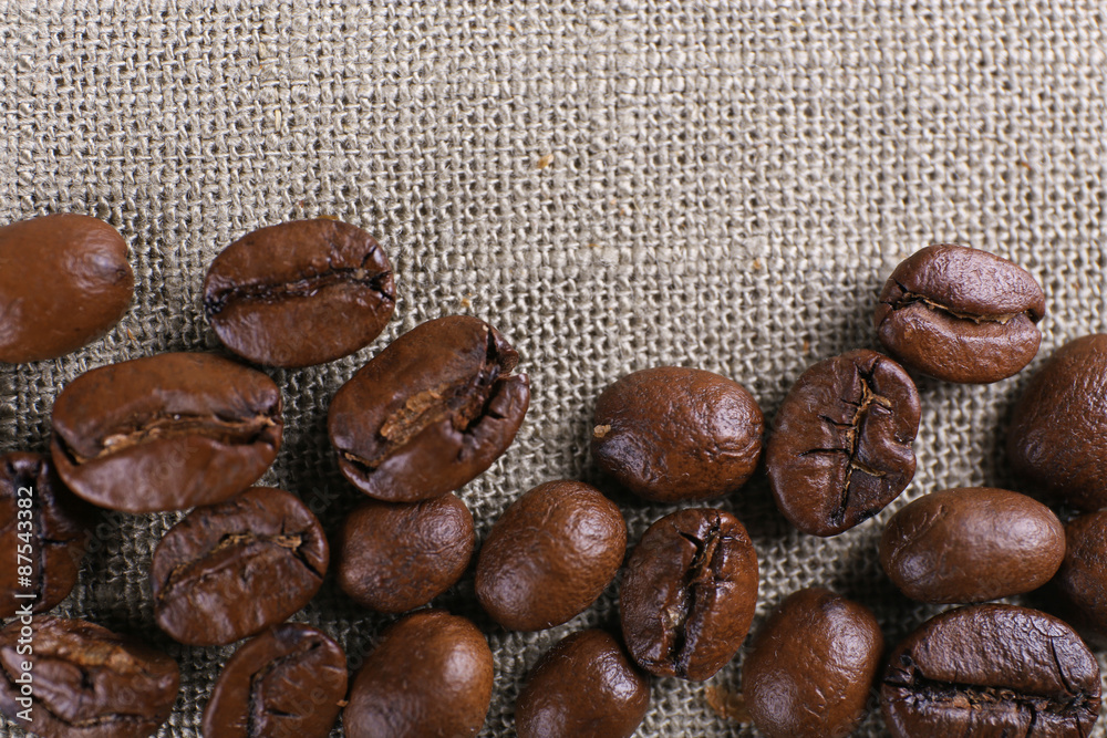 Frame of coffee beans on color sackcloth background Frame of coffee beans on color sackcloth background