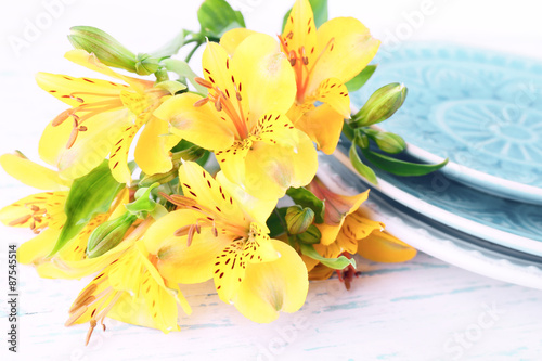 Table setting with flowers  closeup