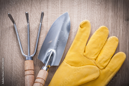 Close up image of steel gardening trowel fork with hand spade an