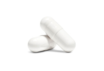 white pill capsule isolated on white background