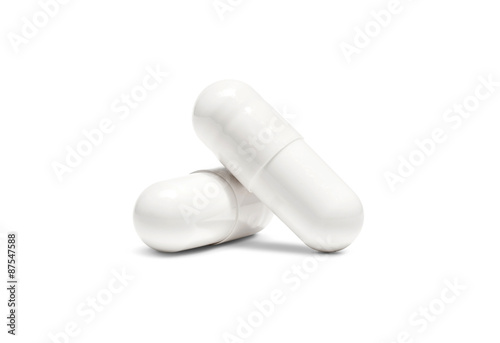 white pill capsule isolated on white background photo
