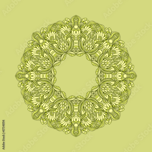 Circle ornament from doodle flowers on green background 