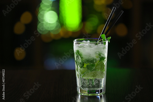 Glass of cocktails on bar background