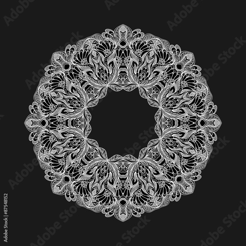 Circle ornament from doodle flowers on black background 