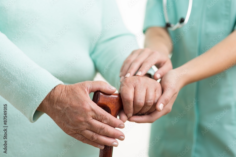 Fotografie Carer helping disabled female