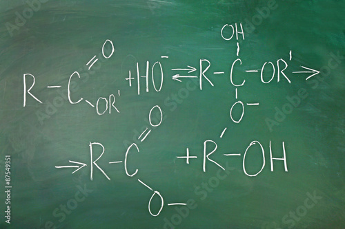 Molecule models and formulas on blackboard background