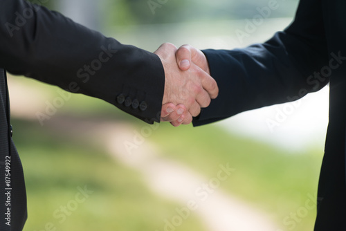 Businessman Shaking Hands Outside The Office
