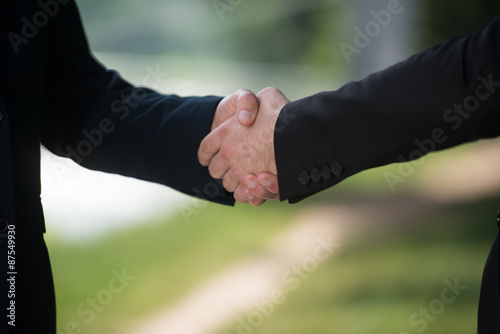 Businessman Shaking Hands Outside The Office