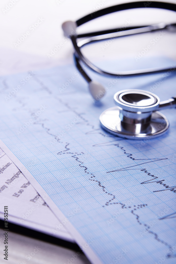 Cardiogram with stethoscope on table, closeup Cardiogram with stethoscope on table, closeup