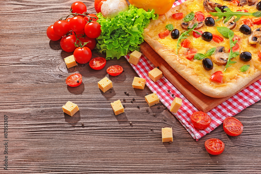 Delicious homemade pizza on table close-up Delicious homemade pizza on table close-up