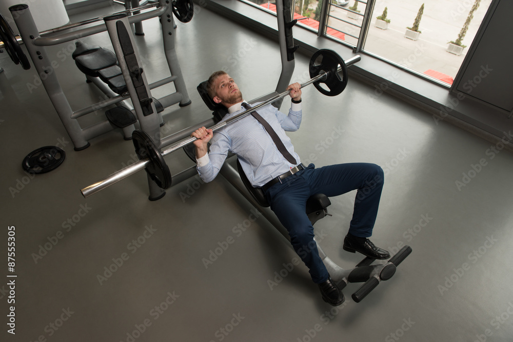 Businessman Exercise Bench Press With Barbell Businessman Exercise Bench Press With Barbell