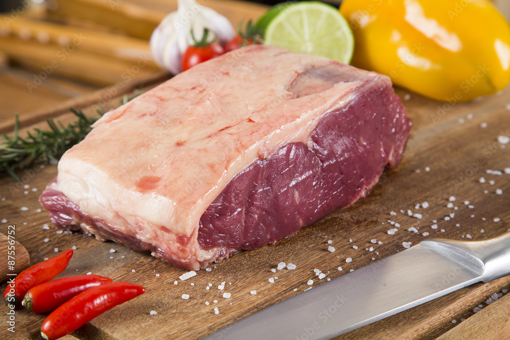 Organic Red Raw Steak Sirloin on wooden board Organic Red Raw Steak Sirloin on wooden board