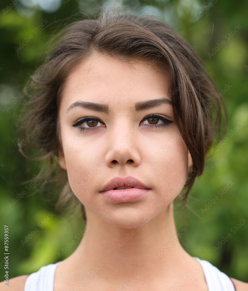 Woman model posing against green natural background. Woman model posing against green natural background.