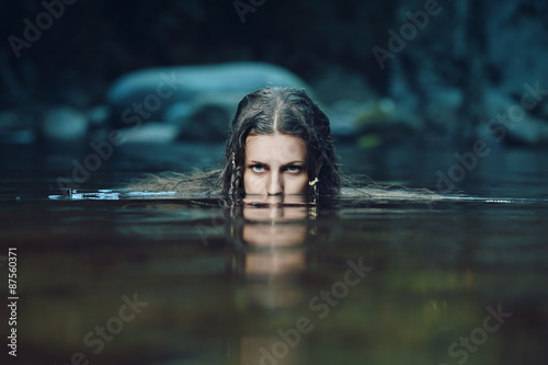 Dark water nymph with intense gaze