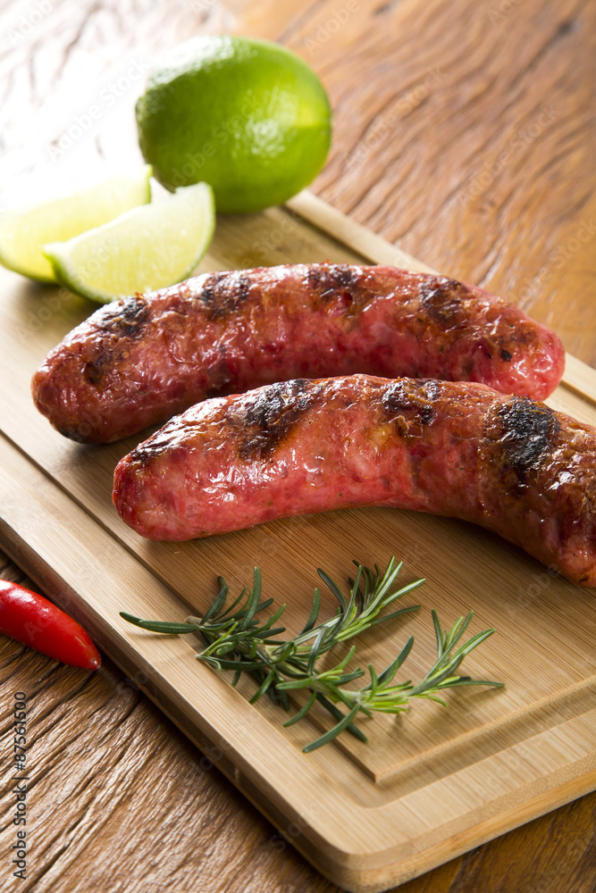grilled meat sausages with potatoes and tomatoes grilled meat sausages with potatoes and tomatoes