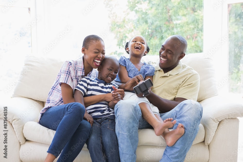 Happy smiling family on the couch Happy smiling family on the couch