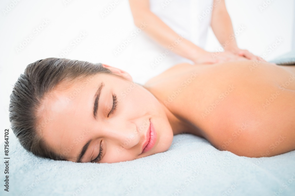 Beautiful brunette enjoying a massage Beautiful brunette enjoying a massage