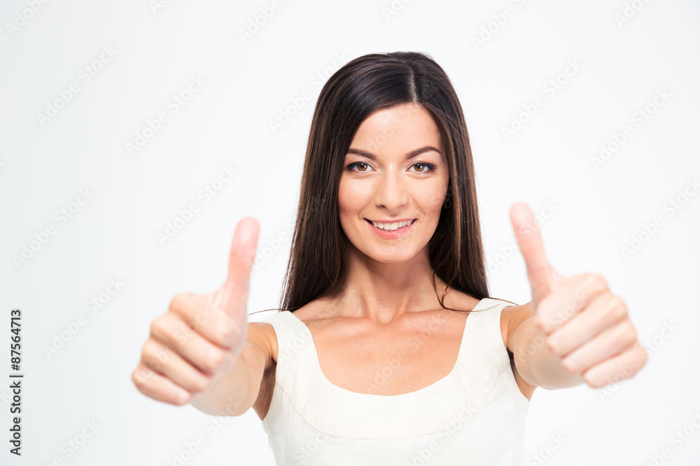Smiling beautiful woman showing thumbs up