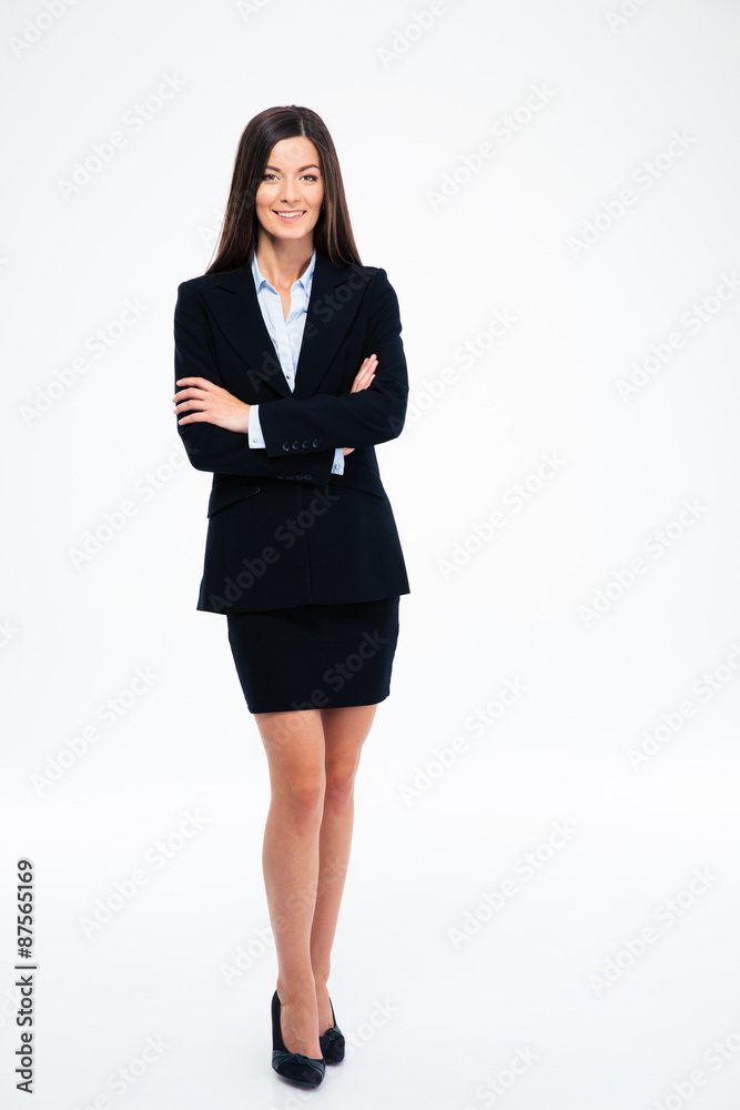 Smiling businesswoman standing with arms folded Smiling businesswoman standing with arms folded