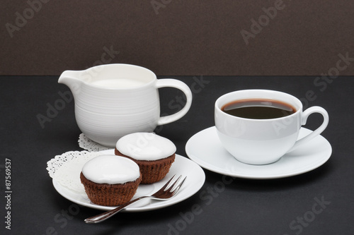 Cupcakes With Cocoa And White Cream. Coffee And Milk