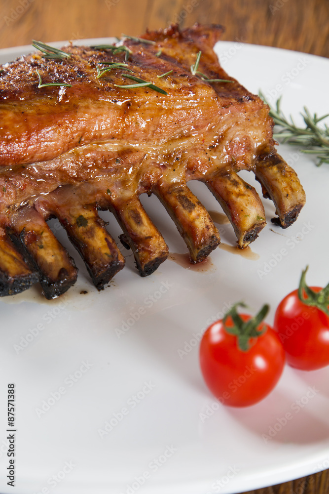 Tasty grilled ribs with vegetables Tasty grilled ribs with vegetables