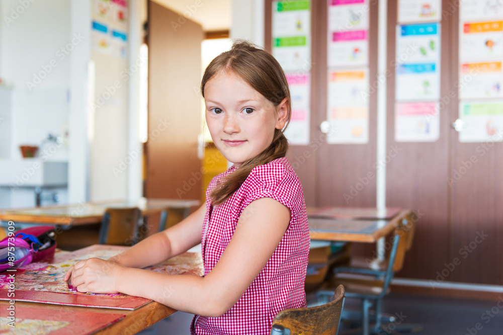 Indoor portrait of a cute little girl in a classroom Indoor portrait of a cute little girl in a classroom