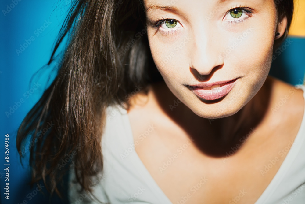 Obraz premium Young brunette woman with green eyes