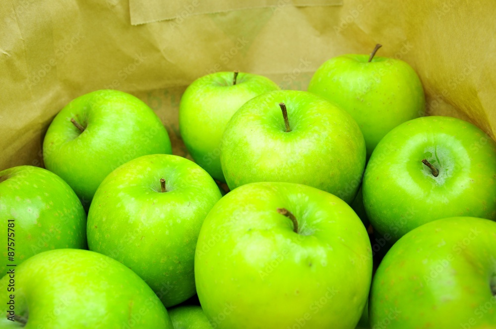 Close up of green apples in shopping bag Close up of green apples in shopping bag
