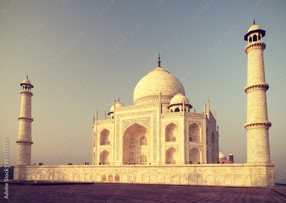 Vintage retro toned sunrise over Taj Mahal, India.