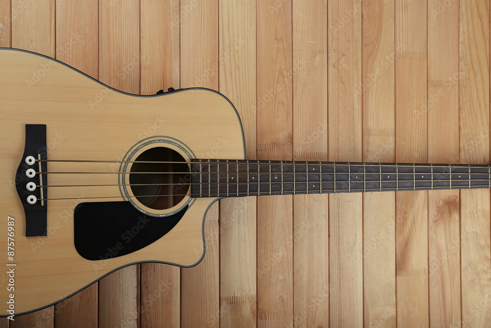 Fototapeta premium Acoustic guitar on wooden background