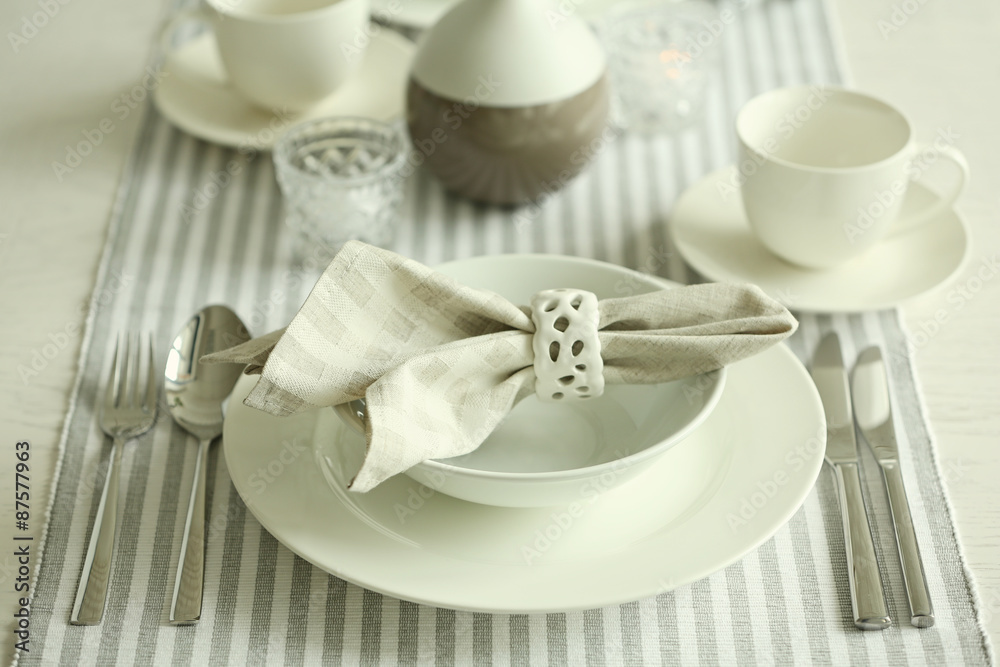 Beautiful holiday table setting in white and gray color Beautiful holiday table setting in white and gray color
