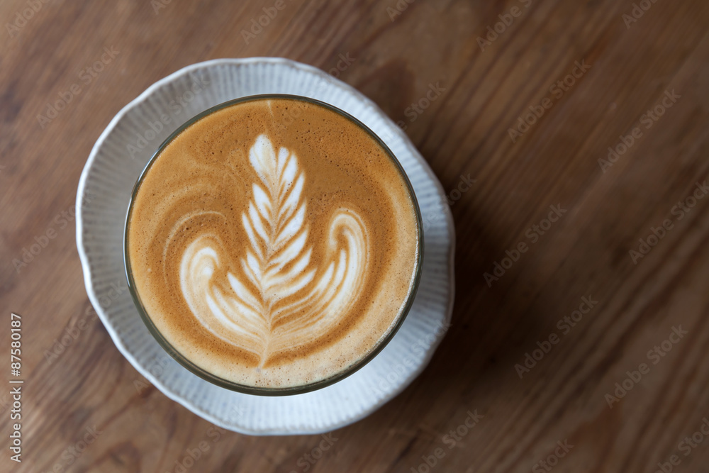 A Cup of latte coffee on wooden table A Cup of latte coffee on wooden table