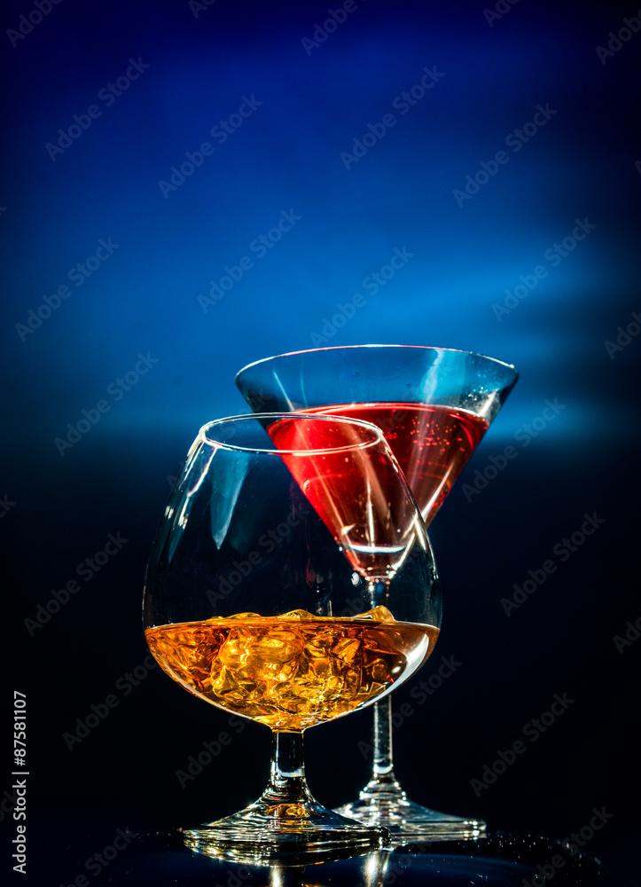 Two glasses with alcohol