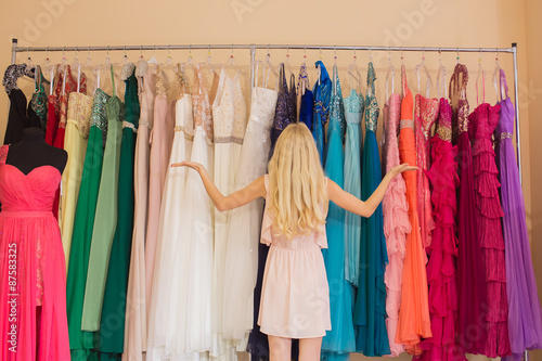 Young woman in dress shop