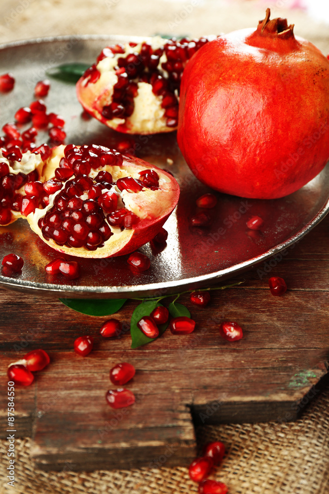 Pomegranate seeds on metal tray, closeup Pomegranate seeds on metal tray, closeup