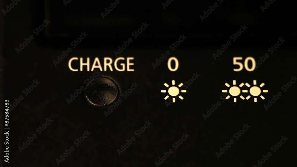 charge scale on the device. The bulb lights up and dies away. charge scale on the device. The bulb lights up and dies away.