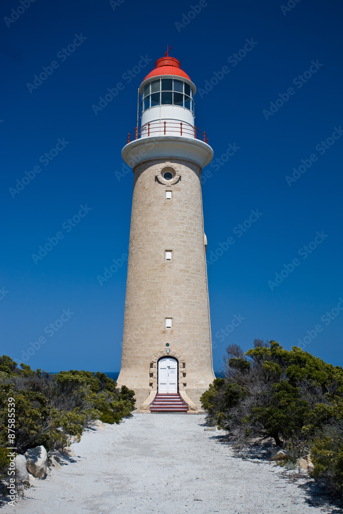 Lighthouse against clear blue sky