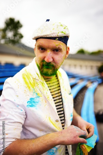 Portrait of bearded man during holi festival photo