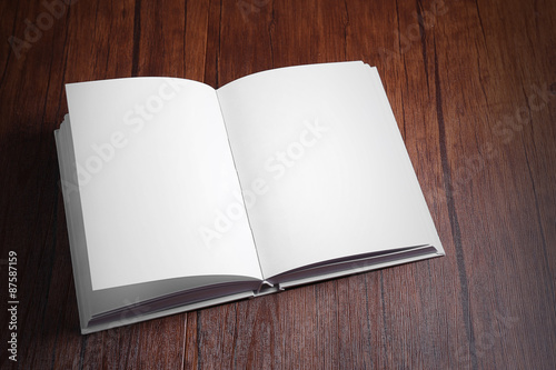 Blank book on wooden background