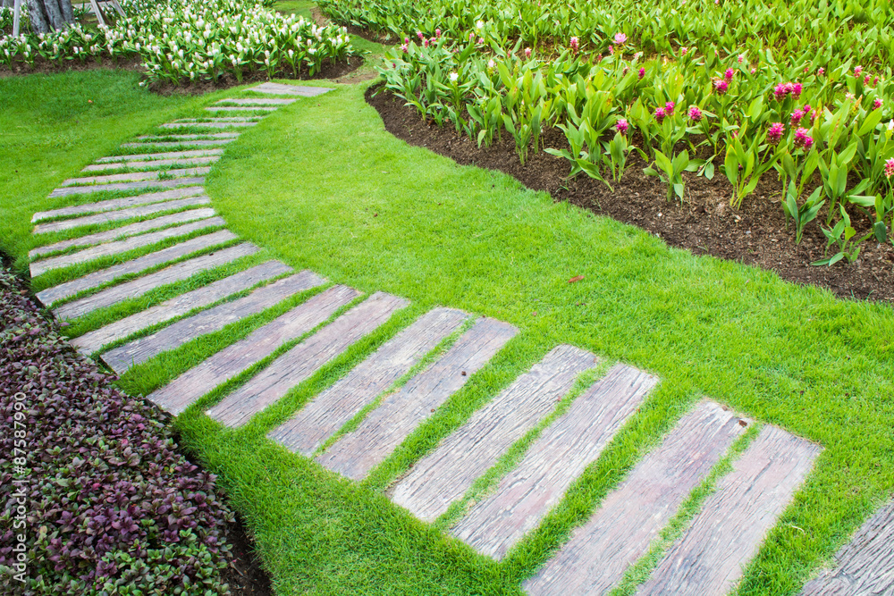 stone walkway in flower garden stone walkway in flower garden